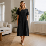 A-linjainen polvipituinen mekko taskuilla